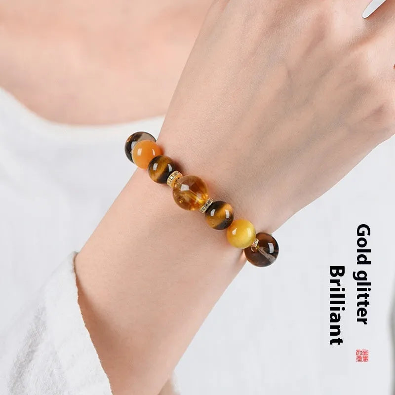 Natural yellow 10mm artificial crystal bead bracelet with an adjustable string tie.