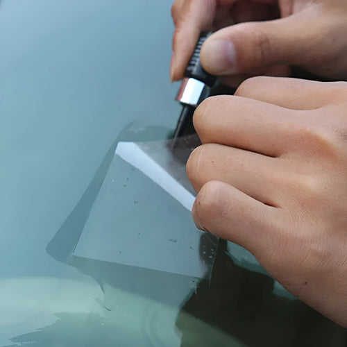 Yellow three-piece car windshield repair agent tool set with applicator and curing tools.
