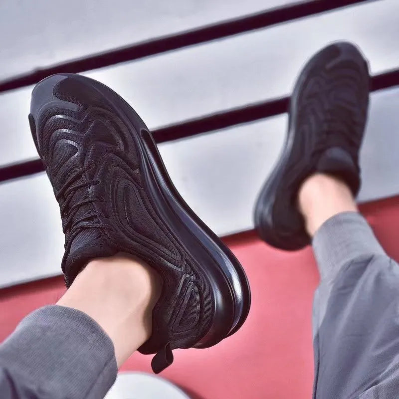 Men's black lace-up running sneakers with a thick sole and round toe design on a white background.