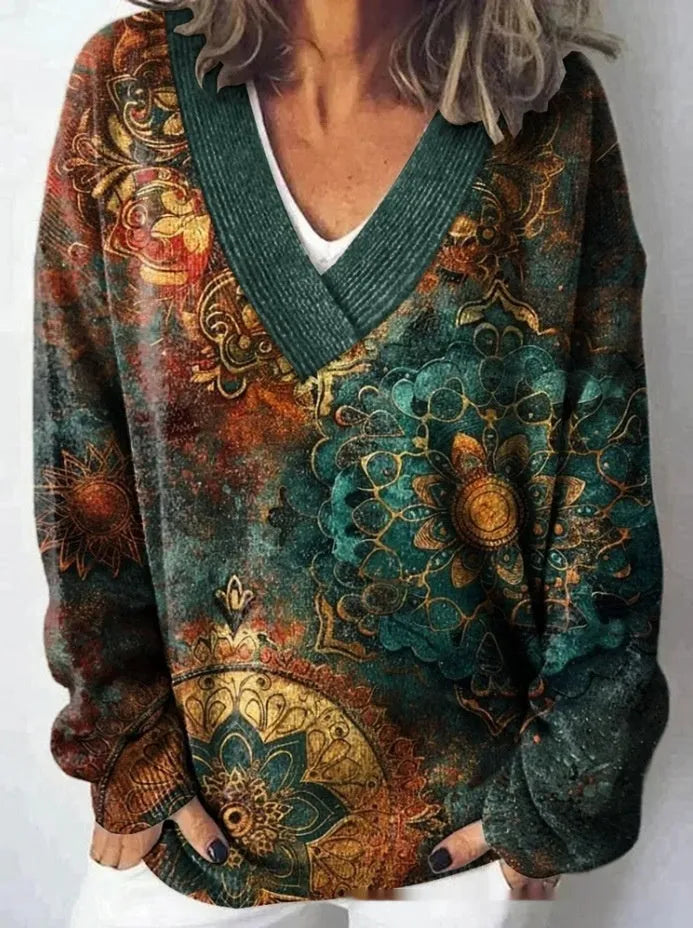 Women's white floral print V-neck sweatshirt with 3D pattern and long sleeves on a hanger.