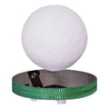 Magnetic suspension moon lamp levitating above its base with colour-changing LED light.