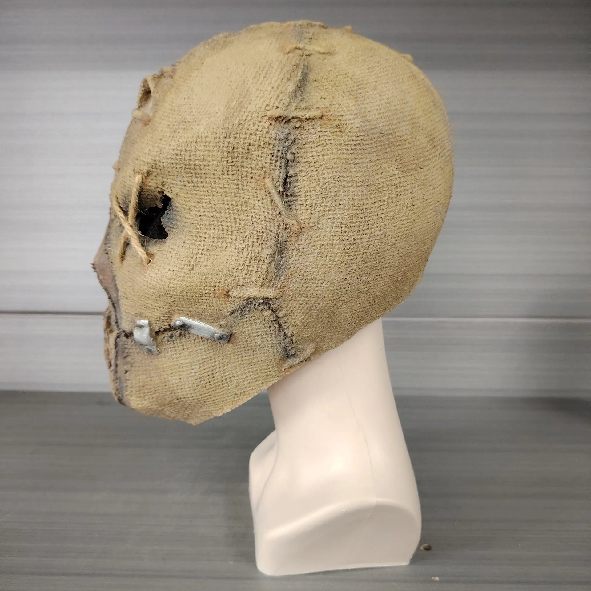Latex Halloween mask with detailed scar skull design shown from front, suitable for adult wear