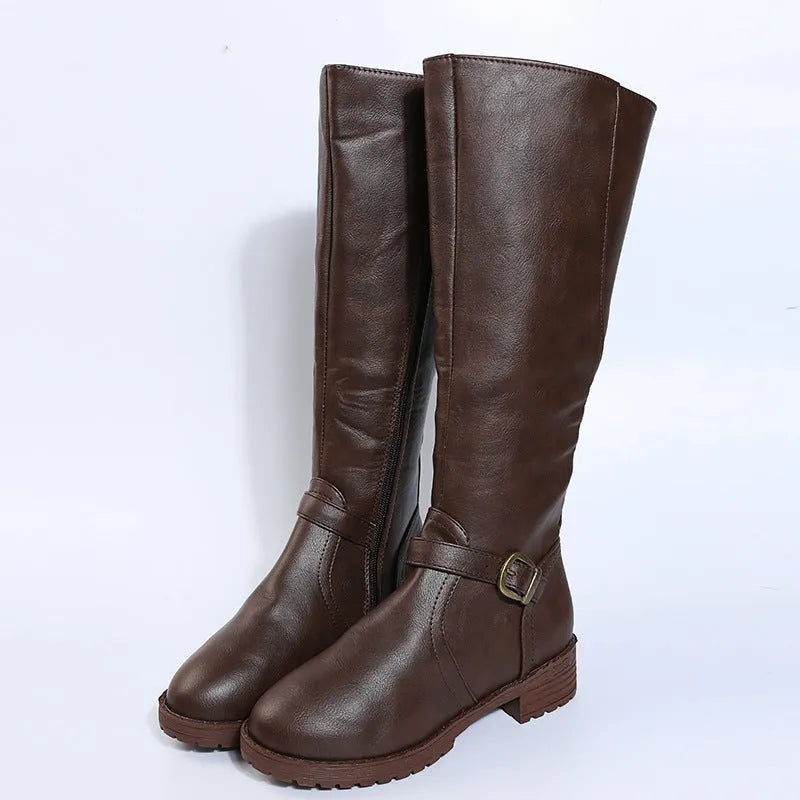 Women's black knight high boots with a square heel, round toe, and a belt buckle detail on the upper.