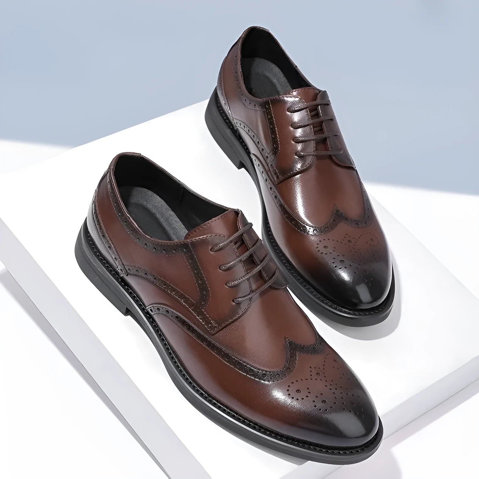 Men's black brogue leather shoes with traditional perforated detailing and lace-up design