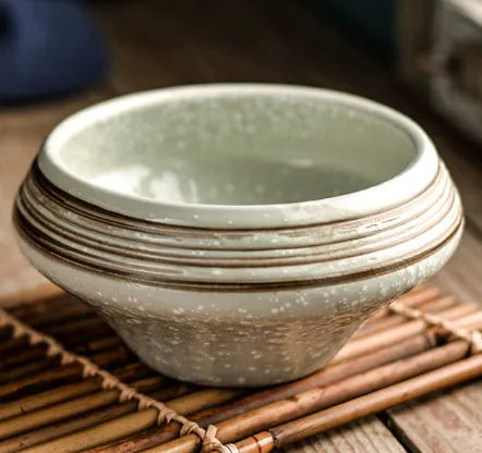 Porcelain Japanese soup bowl in stone conch shape with underglaze finish