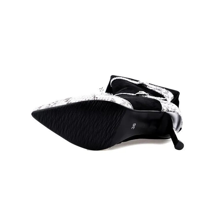 Grey women's knee-high boots with a thin high heel on a rubber sole.