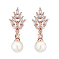 Geometric stud earrings with micro inlaid zircon detailing and floral design in gold, platinum, or rose gold plating