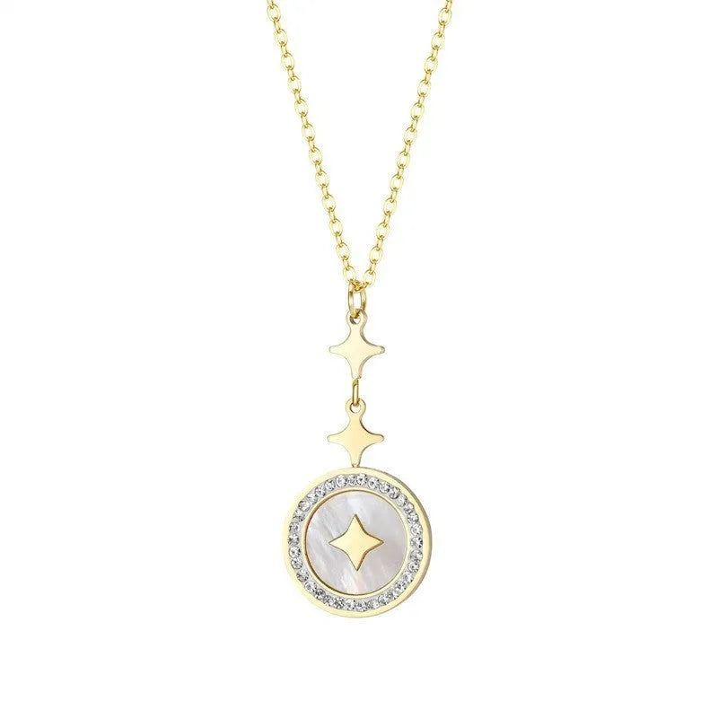 Gold six-pointed star titanium steel necklace on a model, showing the geometric pendant and O-ring chain.