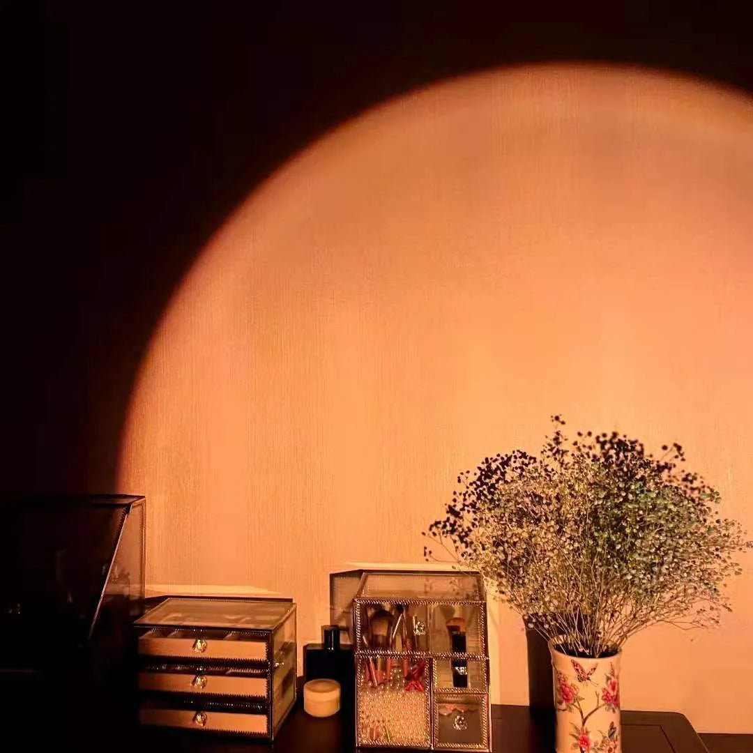 Rechargeable sunset projection lamp showing rainbow atmospheric lighting with USB power connector