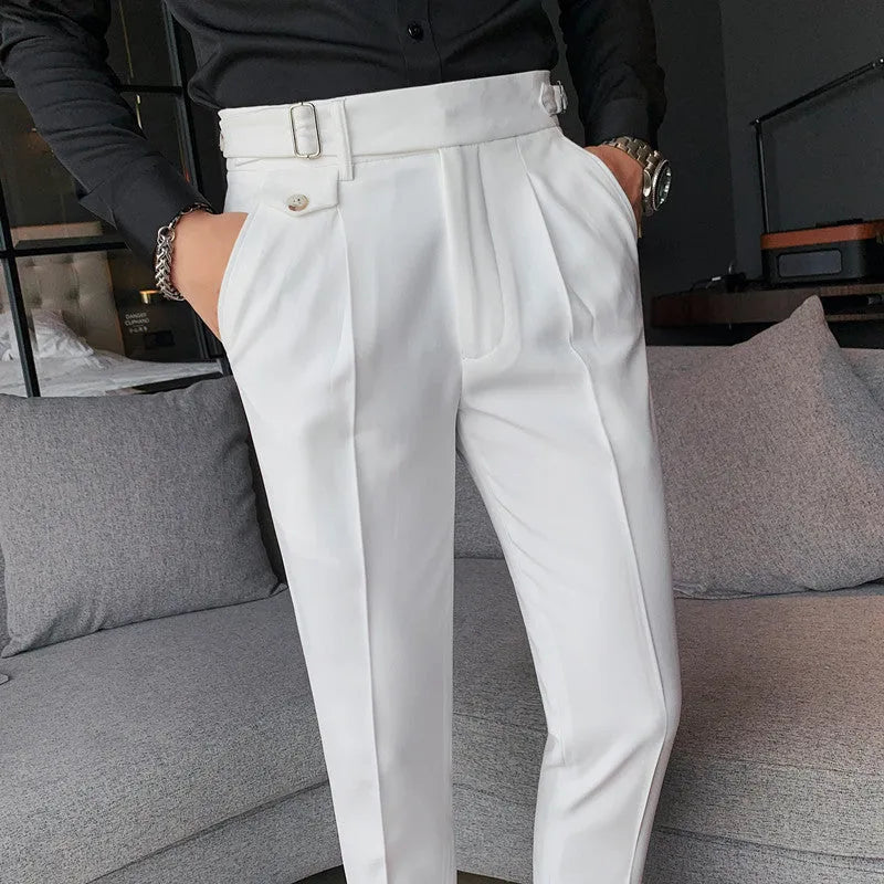 Men's straight leg casual trousers in solid colours including black and grey on a hanger.