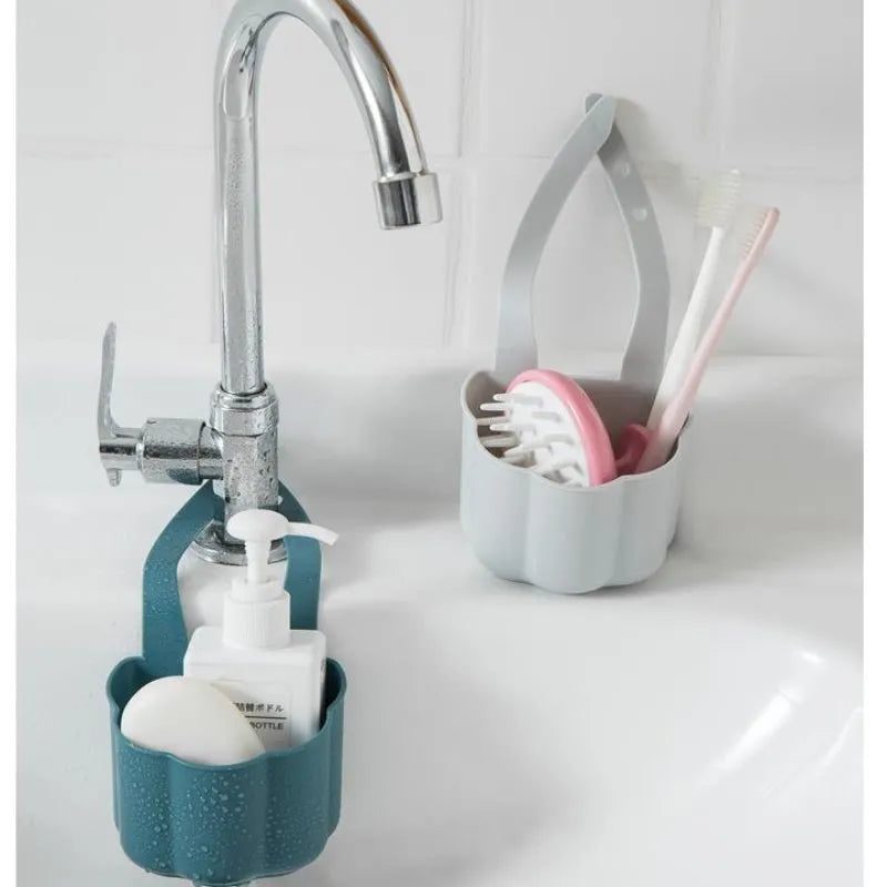 Dark blue Nordic style plastic drain basket next to a kitchen sink