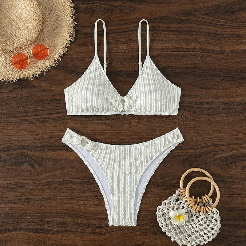 White women's V-neck swimsuit set with matching shorts for swimming