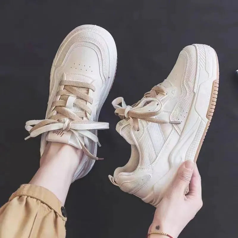 Spring rubber sneaker low top in pink and milky white colours with height increasing function