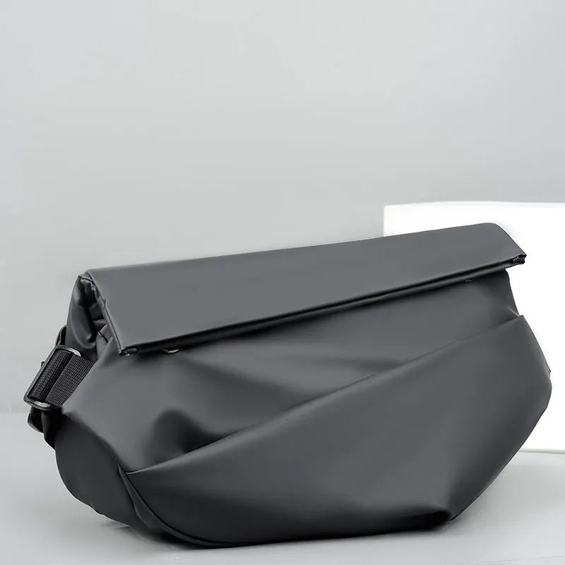 Men's grey crossbody bag showing internal phone pocket and document compartment with shoulder strap