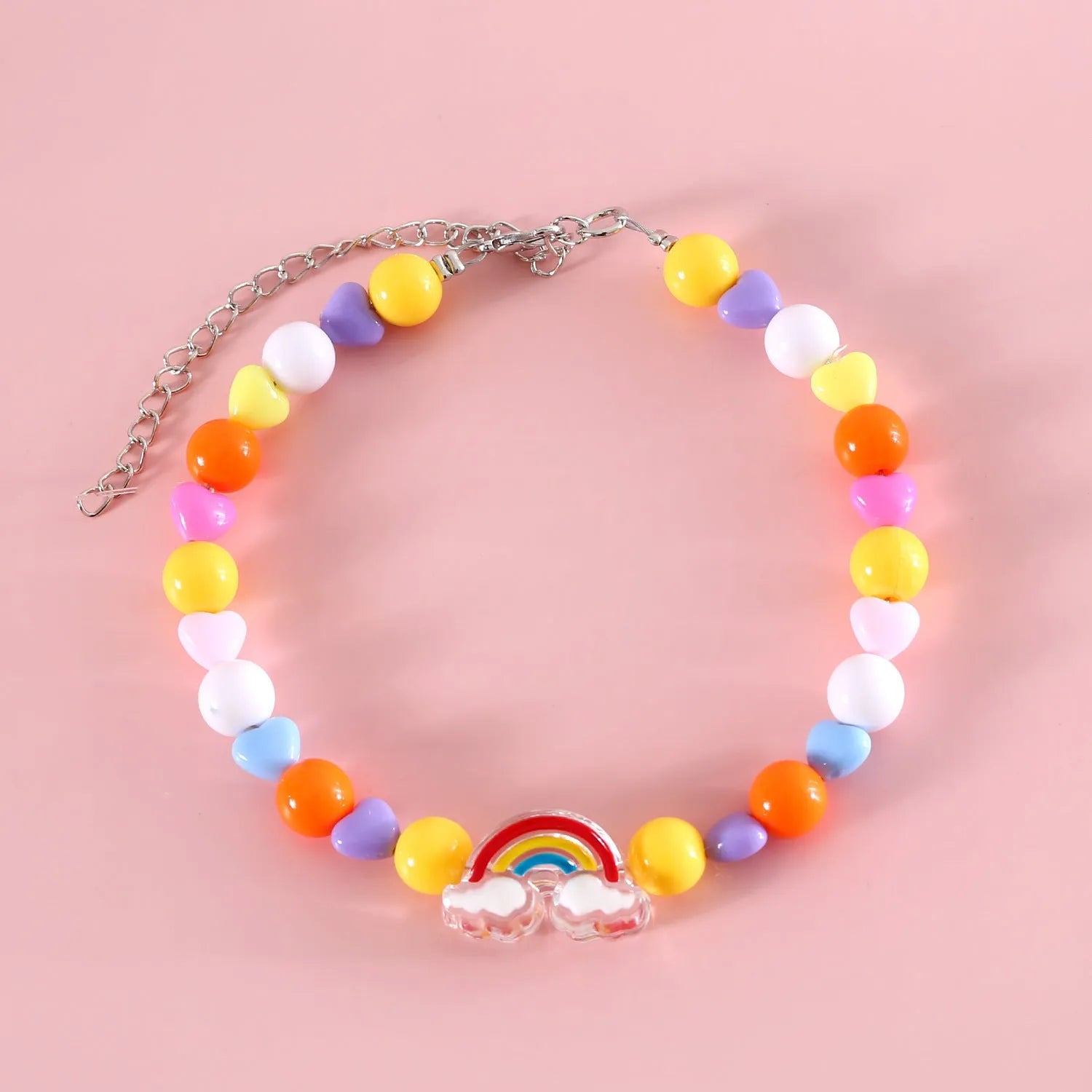 Colourful plastic pearl bead cat necklace with small flower, rainbow, or peach designs on a white background.