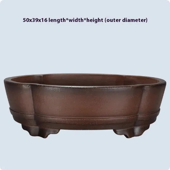 Classical purple clay ceramic bonsai pot with old pile finish, shown on a tabletop.