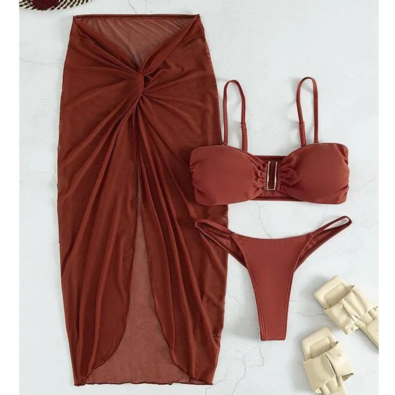 Women's multicolour French-style three-piece bikini set with a long culotte skirt on a hanger.