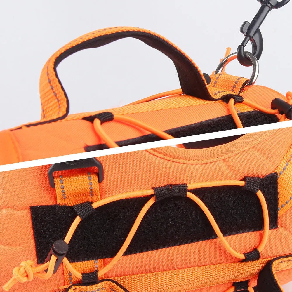 Reflective orange dog harness with black hand holding rope and explosion-proof breast strap.