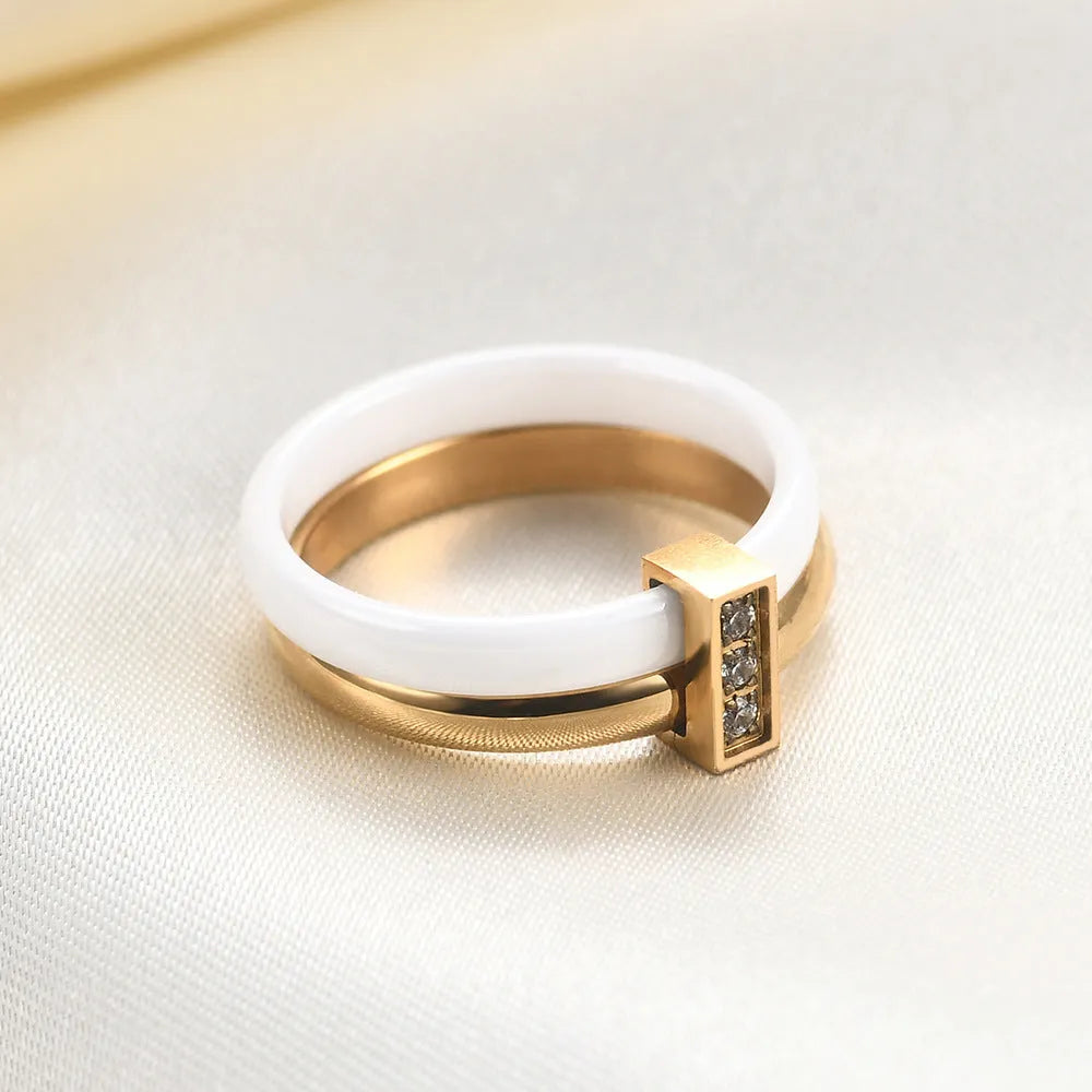 Ceramic ring with geometric shape and zirconium stitching in steel black or golden white colour