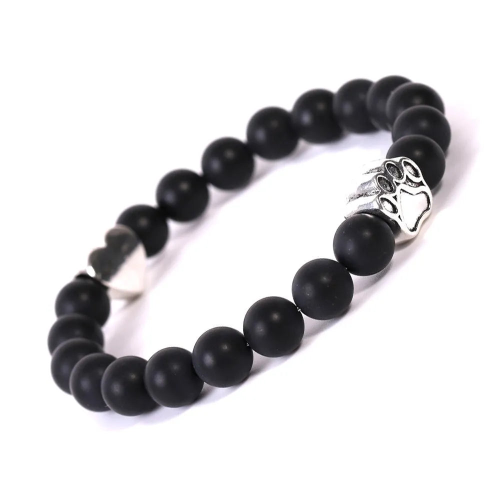 Tigereye Indian Agate stone beaded dog's paw bracelet on wrist, showing geometry shape and round beads.