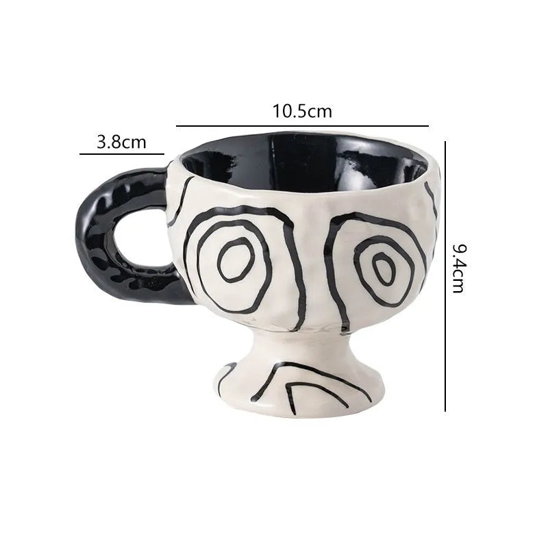 Hand-pinched irregular ceramic mug in a solid colour, showing unique handmade shape.