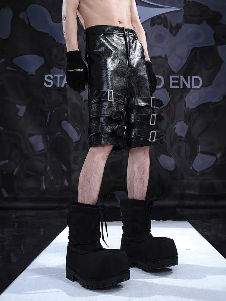 Black men's PU leather casual cropped shorts with a medium-low waist on a mannequin.