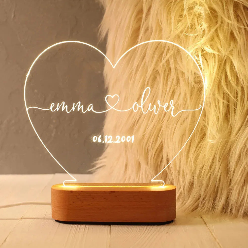 Custom transparent acrylic night light with LED base showing personalised engraving, dimensions 20cm by 11.5cm.