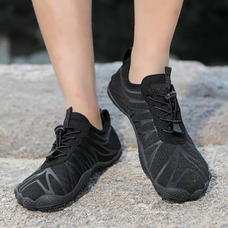 Low-top unisex casual sports running shoe in multiple colours with a lace-up front and rubber sole.