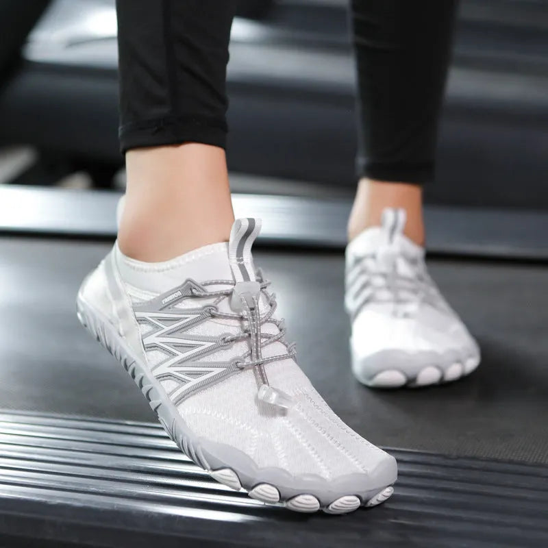 Lightweight striped training sneakers with a mesh upper and non-slip rubber sole in multiple colour options.