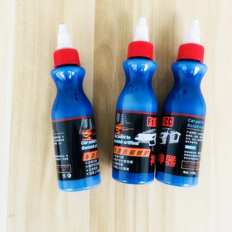 Small blue car wiping tool kit with scratch repair agent bottle and applicator sponge.