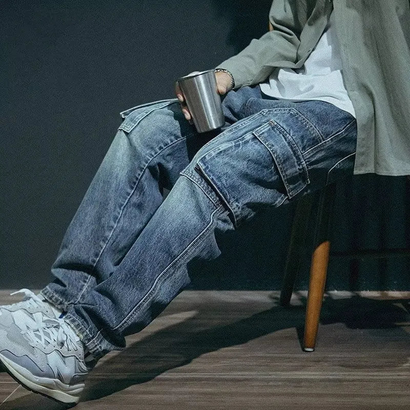 Blue men's loose straight-leg retro stretch denim trousers on a white background.
