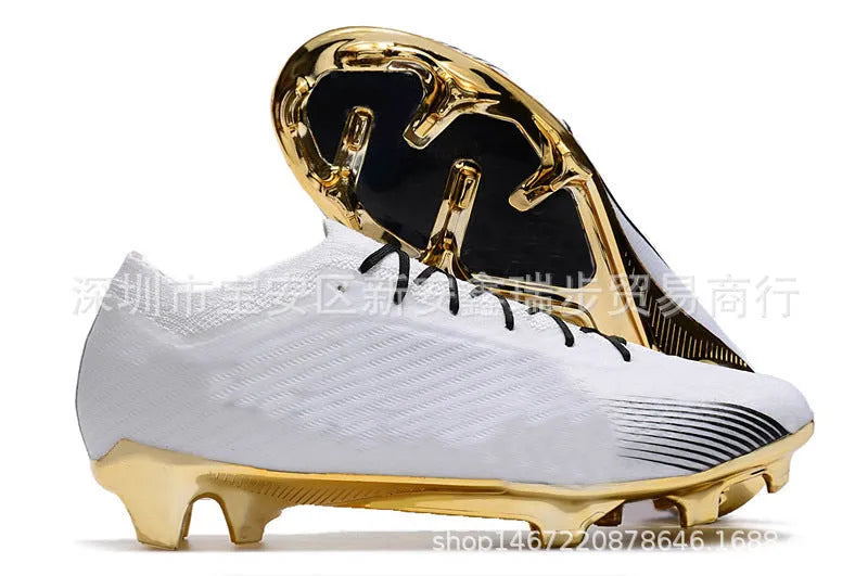 Men's black football shoes with FG studs, knitted upper, and lace-up closure on grass pitch