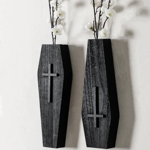 Black wooden cross-shaped wall shelf decoration measuring 27cm by 9cm