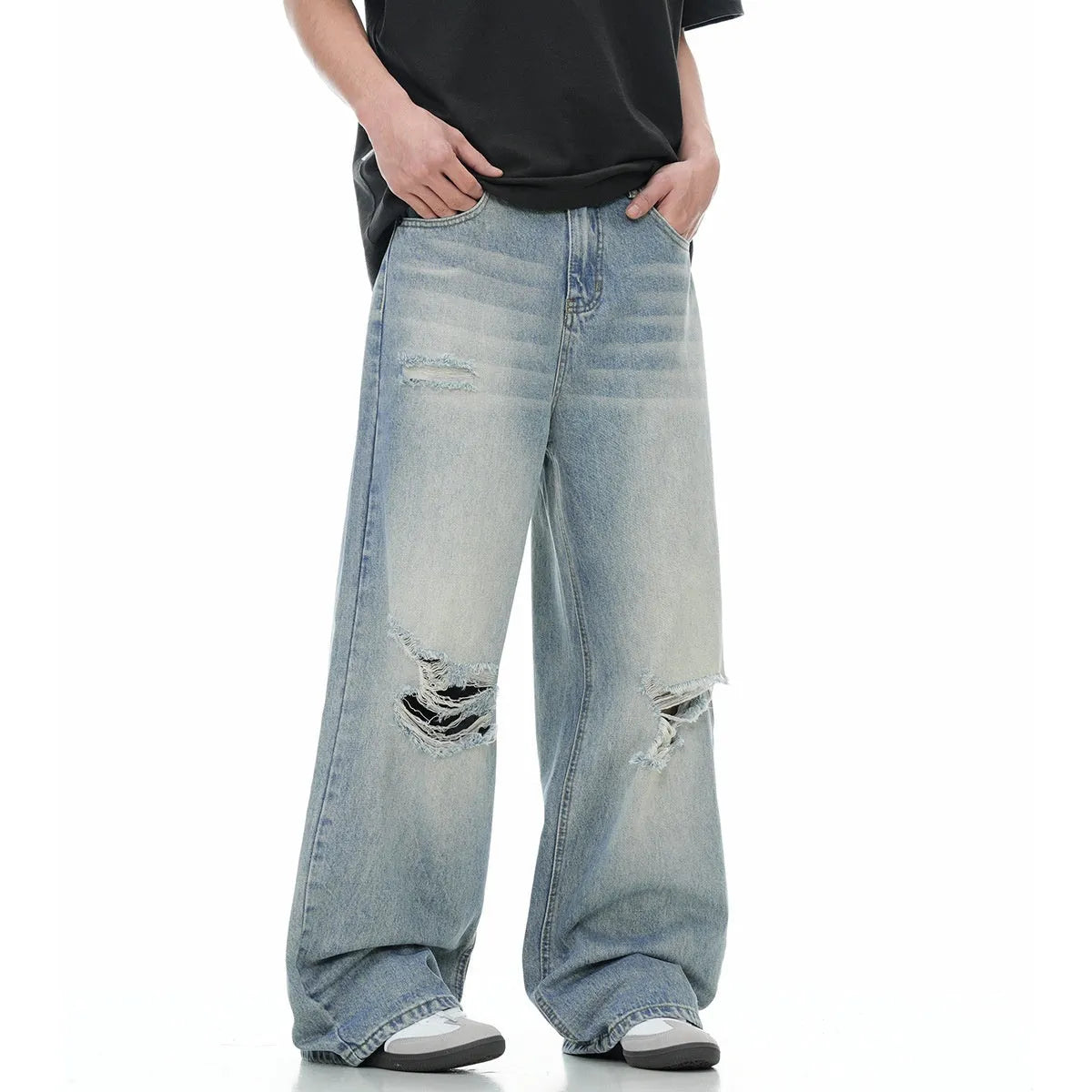 Blue wash straight-leg jeans with ripped detailing and zipper fly opening
