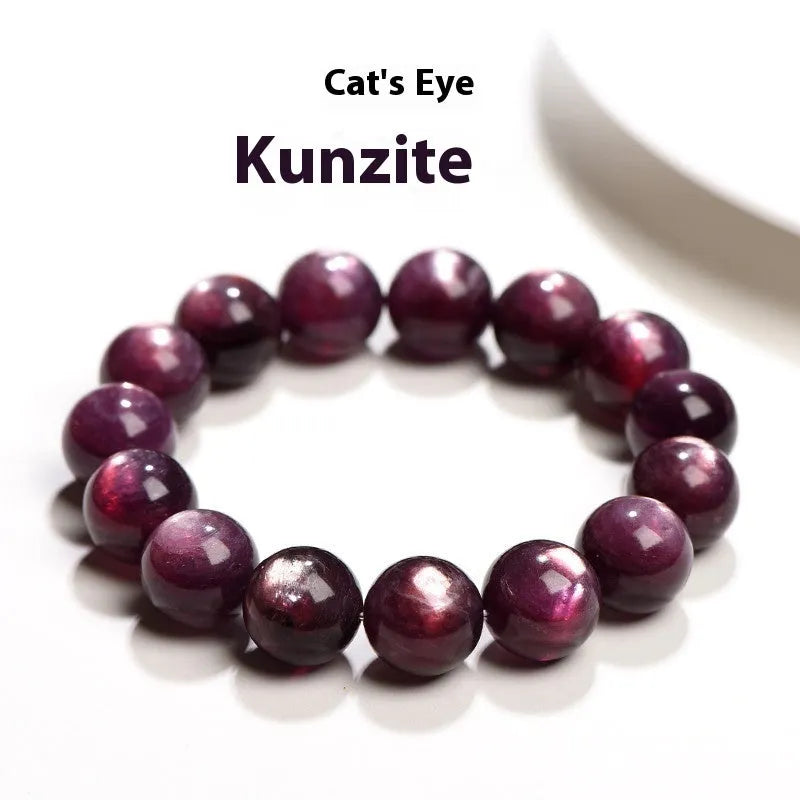 Natural purple lepidolite round bead crystal bracelet showing polished beads on a wrist.