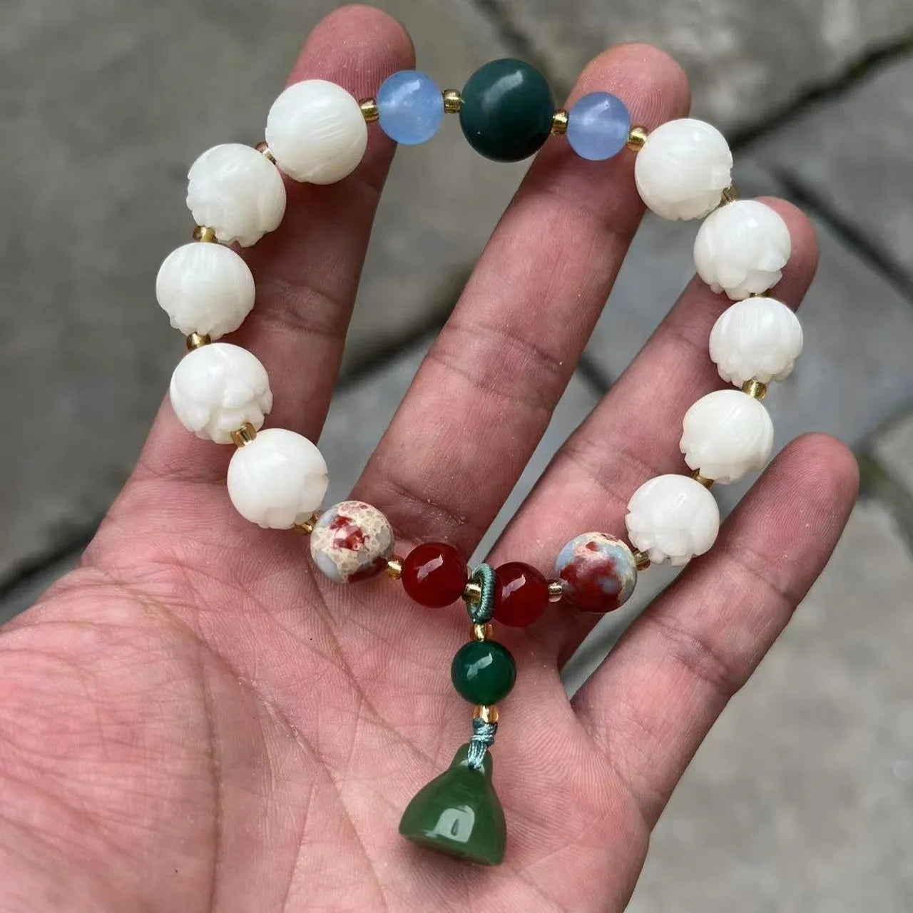 Carved pumpkin lotus bodhi root bracelet with white jade segments and golden silk jade treasures