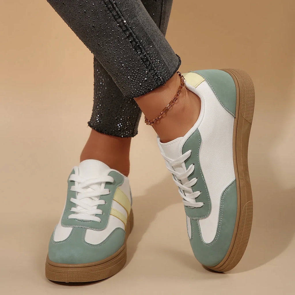 Women's green retro sports shoes with cross straps and leather stitching, low-top design with rubber sole