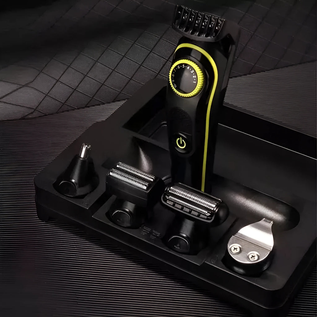 Black KM-696 rechargeable electric hair clipper set with stainless steel blade and cleaning brush.