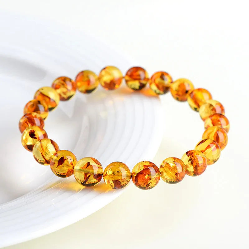 Natural yellow piebald amber geometric bracelet with polished beads