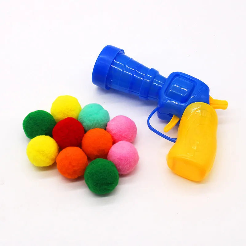 Interactive pet toy gun with plush balls for dogs and cats, showing launcher with 30cm barrel and multiple soft balls