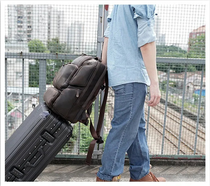 Dark brown leather backpack with 17-inch computer compartment and organisational pockets