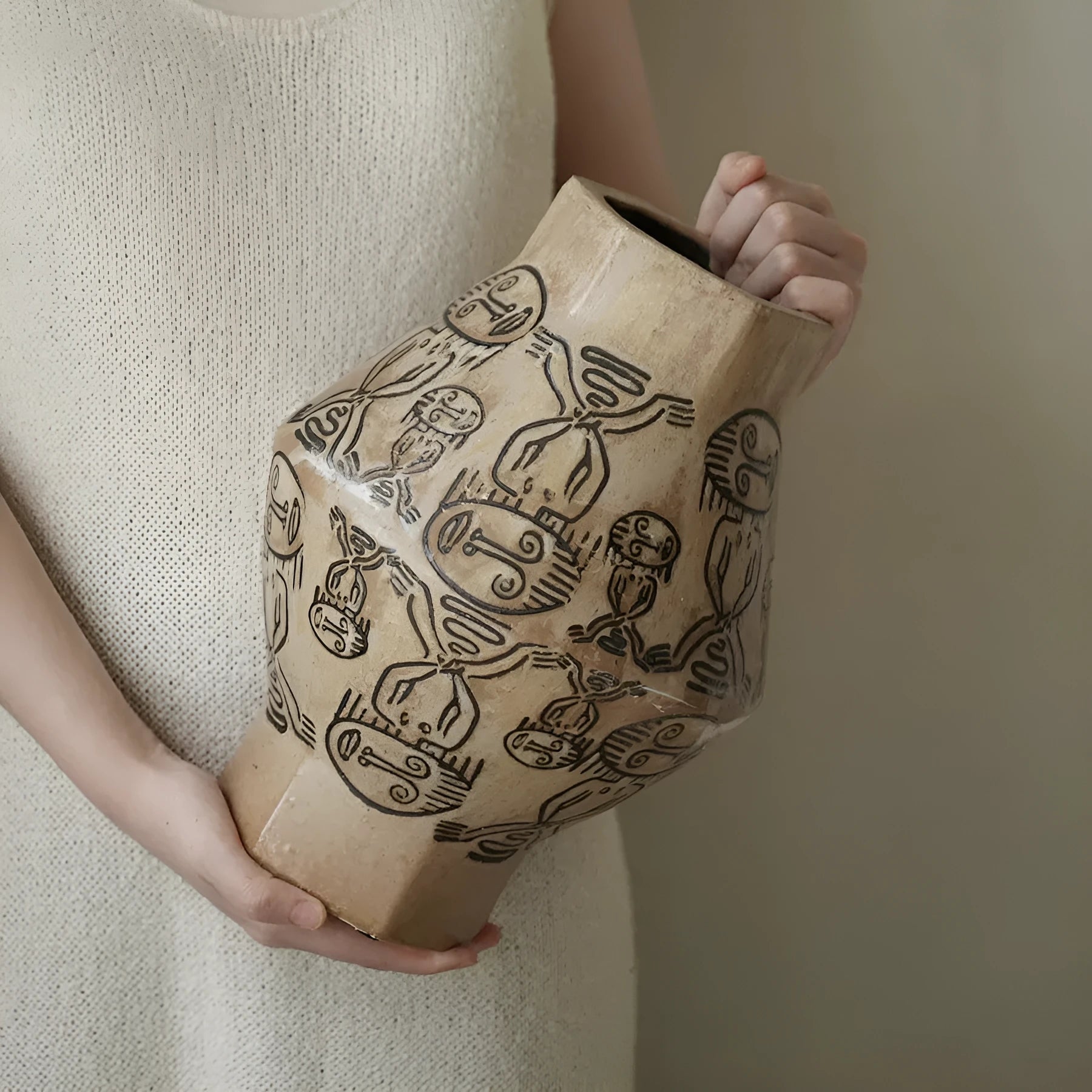 Hand-painted ceramic vase with carved tribal totem flower pattern in cylindrical shape