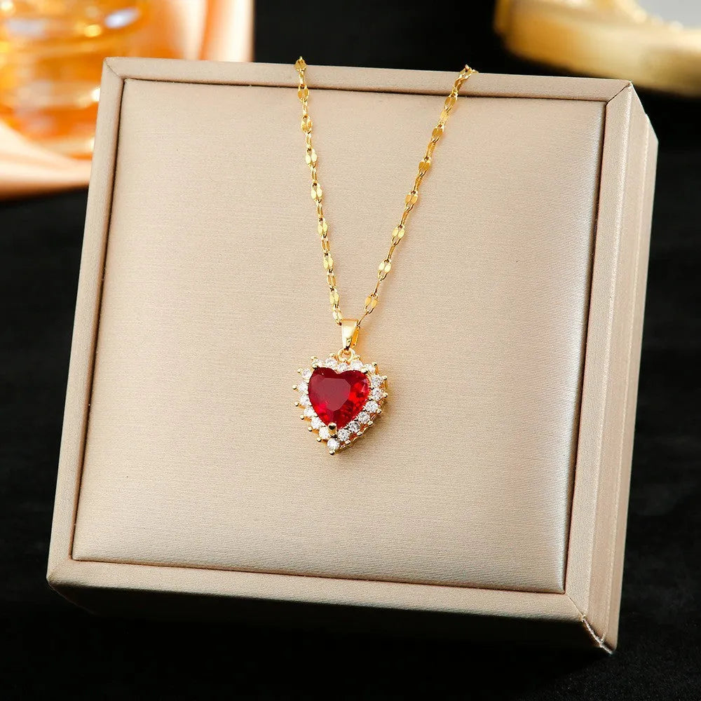 Gold red titanium steel necklace with hearts flower pendant and mixed gemstone inlay, matching ring and earrings.