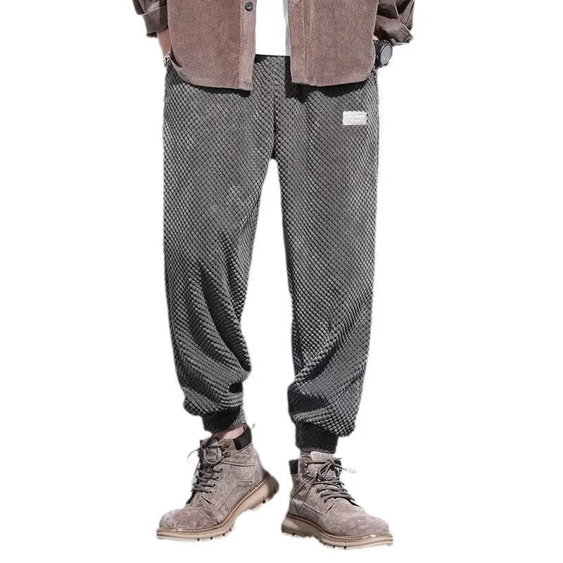 Men's grey straight-leg casual sweatpants with an ankle-tied design on a white background.