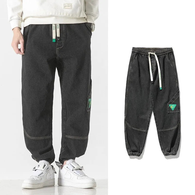 Men's cotton loose-fit tapered trousers in black, blue, or grey colours with mid-waist design