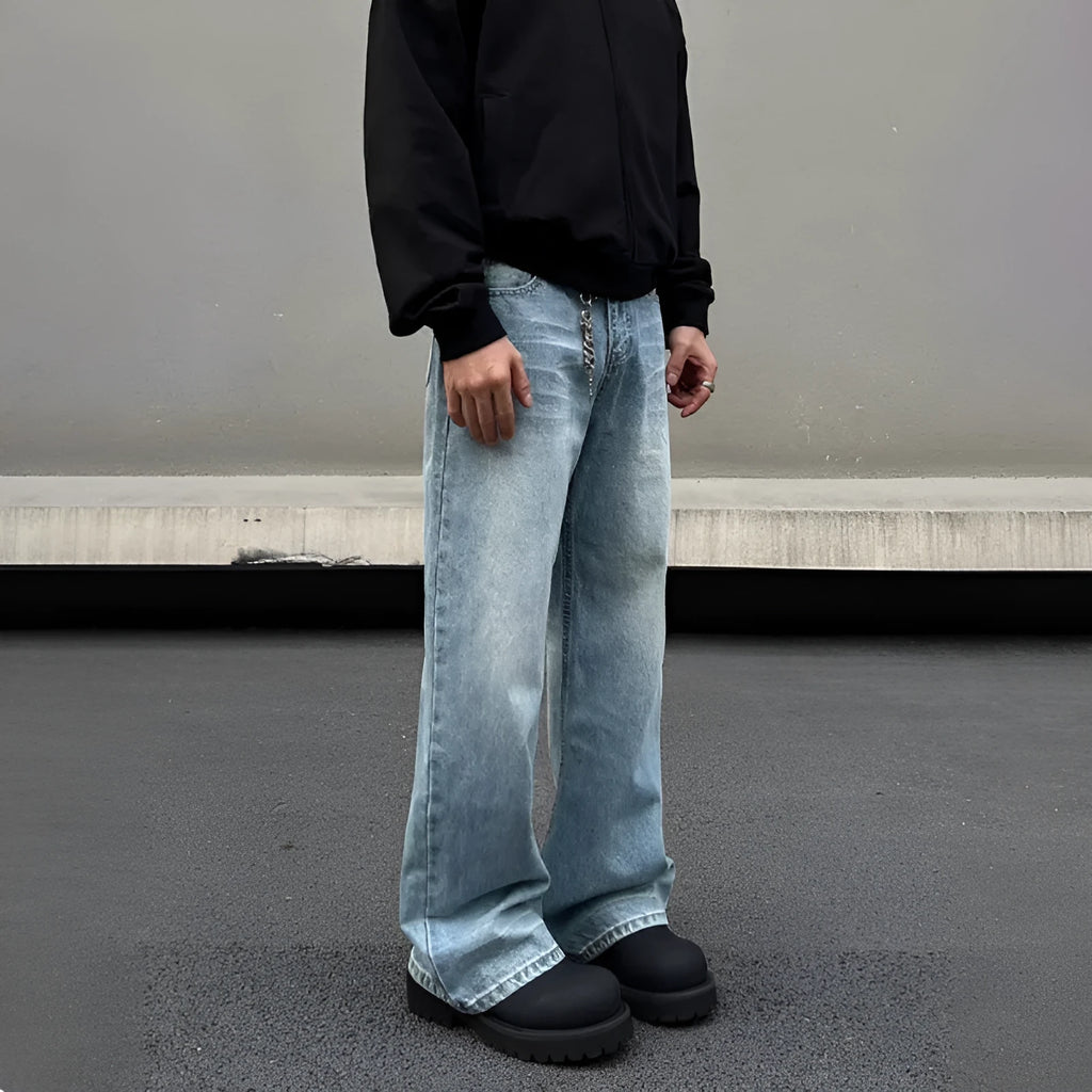 Men's blue straight leg jeans with whisker wash detailing and visible stitching on medium-high waist