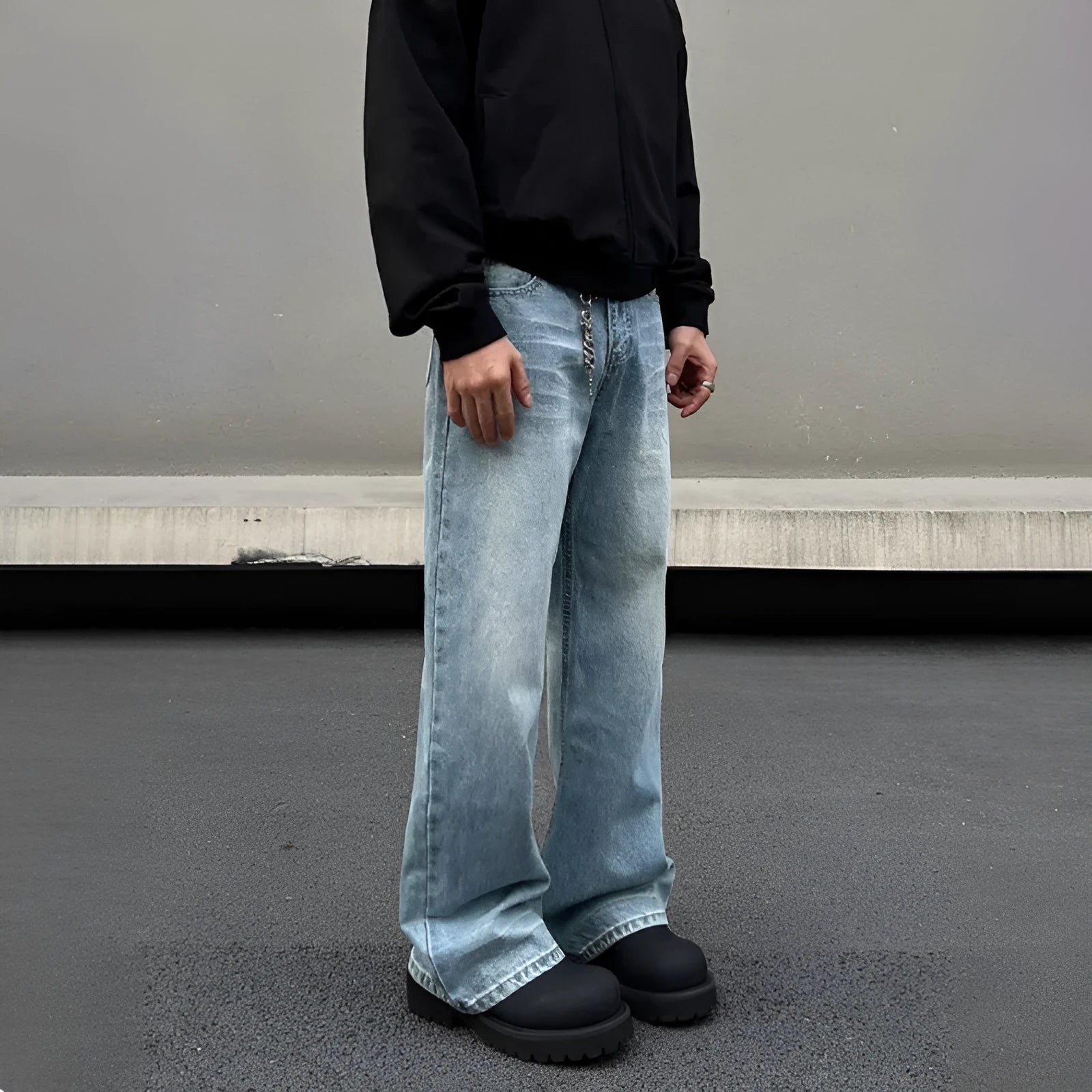 Men's blue straight leg jeans with whisker wash detailing and visible stitching on medium-high waist