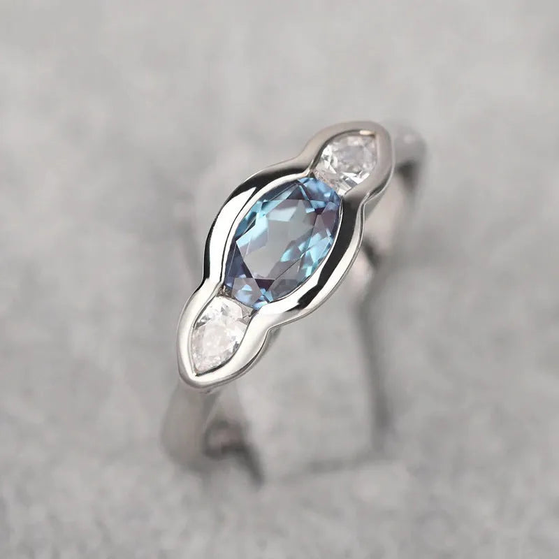 Geometric ellipse women's ring with inlaid zircon stones in Q941 white gold finish
