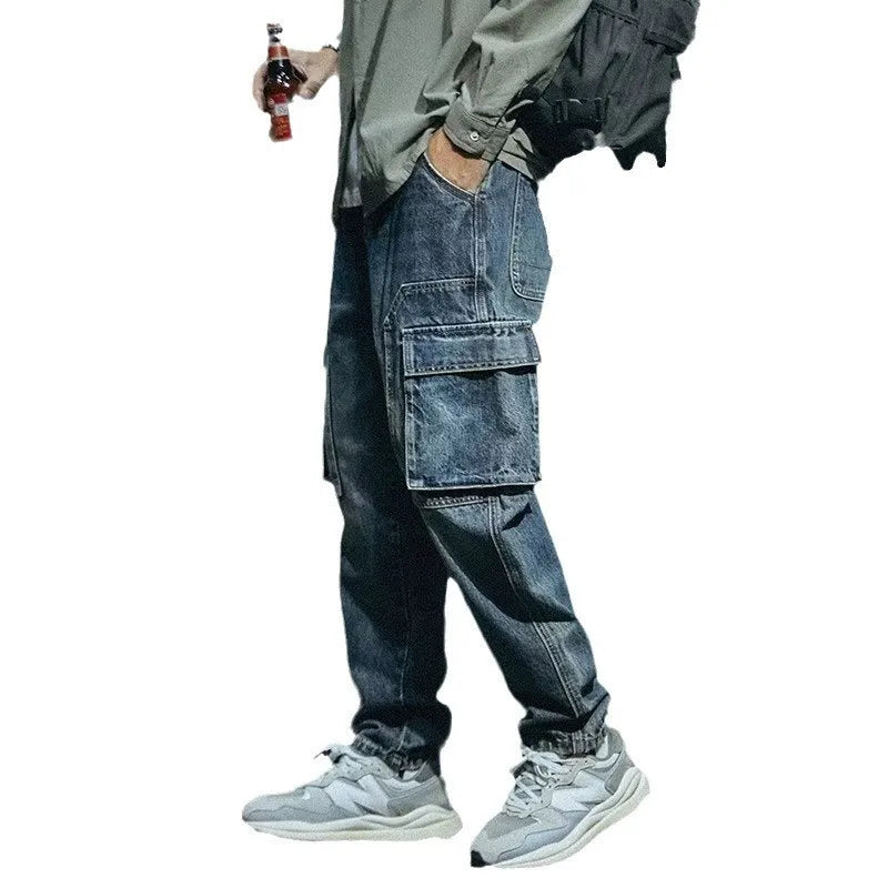 Blue men's loose straight-leg retro stretch denim trousers on a white background.
