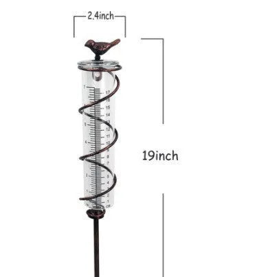 Cast iron bird garden rain gauge with glass measuring tube showing hummingbird design